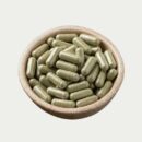 kratom capsules in a bowl showing bulk capsules in a image